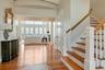 Entryway featuring light hardwood / wood-style flooring and a high ceiling