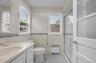 Convenient 1st floor full bathroom with walk in shower , 2 windows and a skylight.