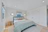 Bedroom featuring light wood-type flooring, recessed lighting, and a closet
