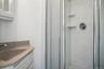 Bathroom with vanity and an enclosed shower