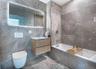 Modern bathroom featuring full-height stone-look tile walls and flooring