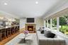 As you enter you are greeted into the living room overlooking open concept kitchen. Couch, table & area rug have been virtually staged.