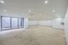 Spare room with unfinished concrete floors and recessed lighting