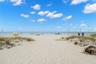 opportunity to own a newer, income-producing, direct Gulf-front unit in one of Treasure Island’s most desirable beachfront developments.