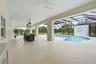 4000 sq ft lanai with covered areas, bar, & outdoor kitchen