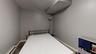 Bedroom featuring a baseboard radiator and dark hardwood / wood-style flooring