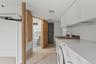 Laundry area featuring cabinet space, independent washer and dryer, and light tile patterned floors