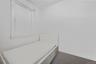 Carpeted bedroom featuring baseboards