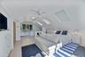 Private en-suite queen bedroom with separate entrance to its own exterior living space and common backyard. Office area with en-suite bathroom and fea