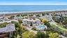 Bird's eye view with a view of the beach and a water view