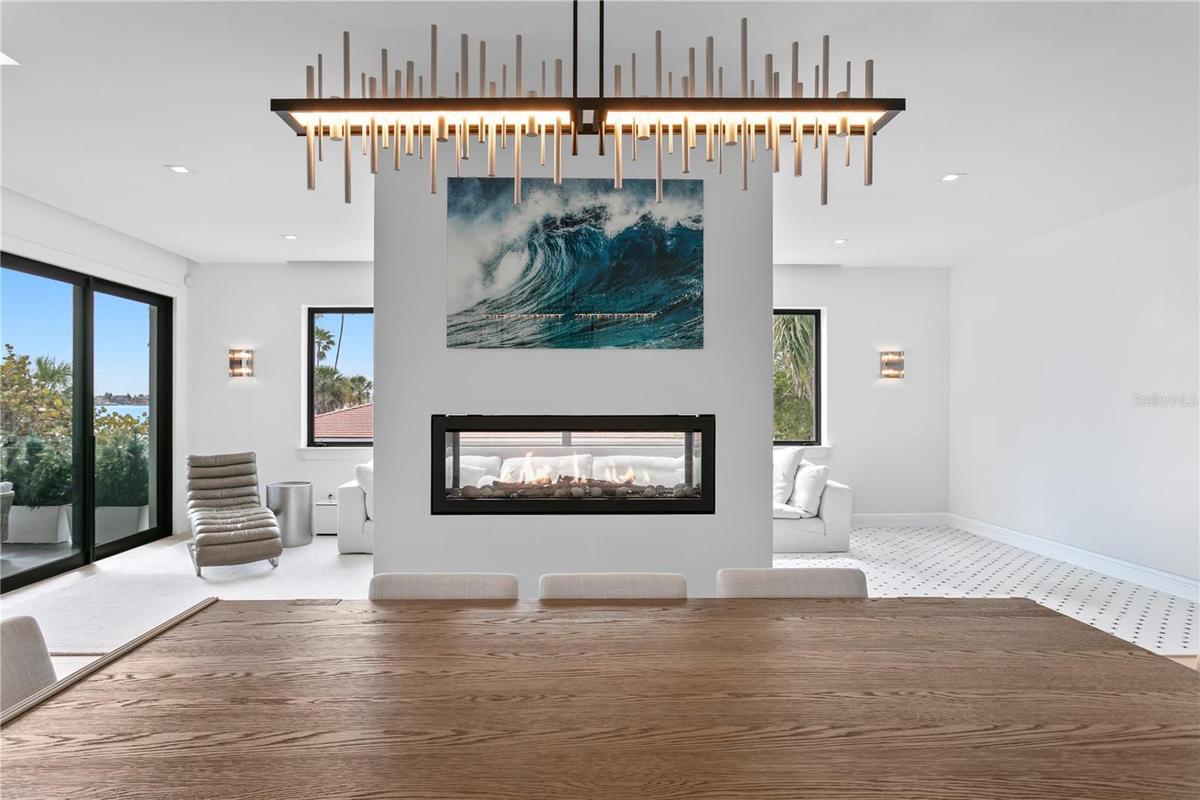 see through fireplace standing in the dining room