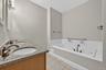 The primary bathroom features a double vanity soaking tub, and separate shower offering a spacious ensuite layout ready for your personal style.