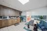 Kitchen featuring appliances with stainless steel finishes and dark brown cabinetry