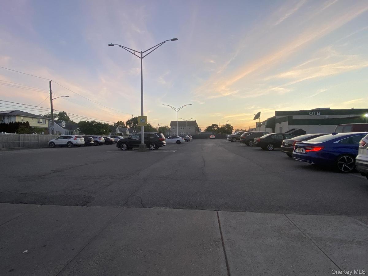 View of asphalt road with street lights