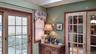 French doors with multiple lites and wood trim