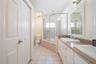 Clean, functional guest bathroom with bright lighting