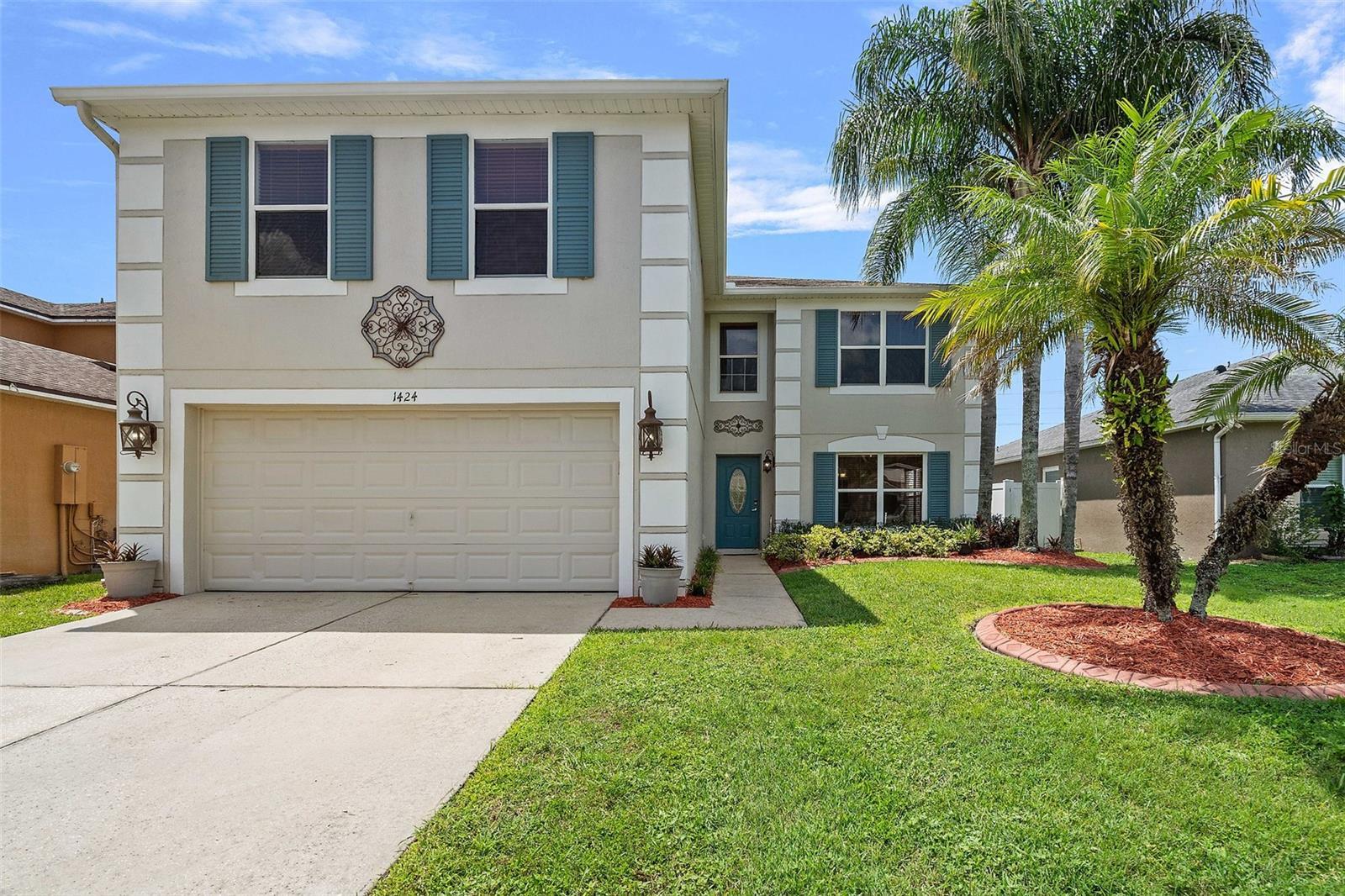Front Exterior of the 2-story home with 2 car garage