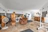 Living area featuring washer and clothes dryer