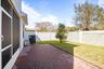 Paver lanai and fenced backyard