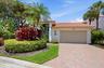 Front exterior of 2552 Sheltingham Drive in Palm Beach Polo, Wellington FL luxury rental home