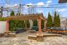 Patio with gazebo, fire pit and outdoor dining area