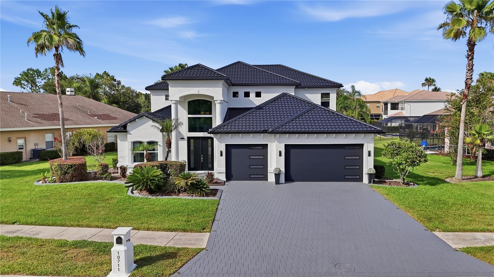 Impressive curb appeal that comes from new metal roof, new double pane windows and new exterior paint with hurricane impact garage door and font door