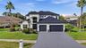 Impressive curb appeal that comes from new metal roof, new double pane windows and new exterior paint with hurricane impact garage door and font door