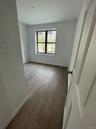 Spare room with wood finished floors and baseboards