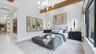 Primary bedroom with abundant natural light and a water view