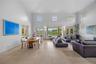 From the moment you enter the home, your attention is drawn to an oversized picture window that perfectly frames the infinity-edge pool and tranquil l