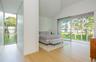 Bedroom featuring light wood-style flooring, access to exterior, and lofted ceiling