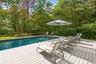 Outdoor pool featuring a wooden deck