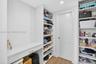 Guest closet even has a desk or makeup vanity area!