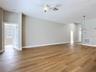bright open-concept layout with new vinyl flooring, a fully renovated kitchen