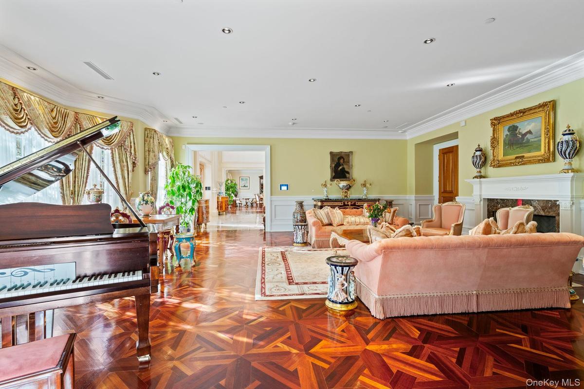 Formal living space featuring parquet wood-finish flooring