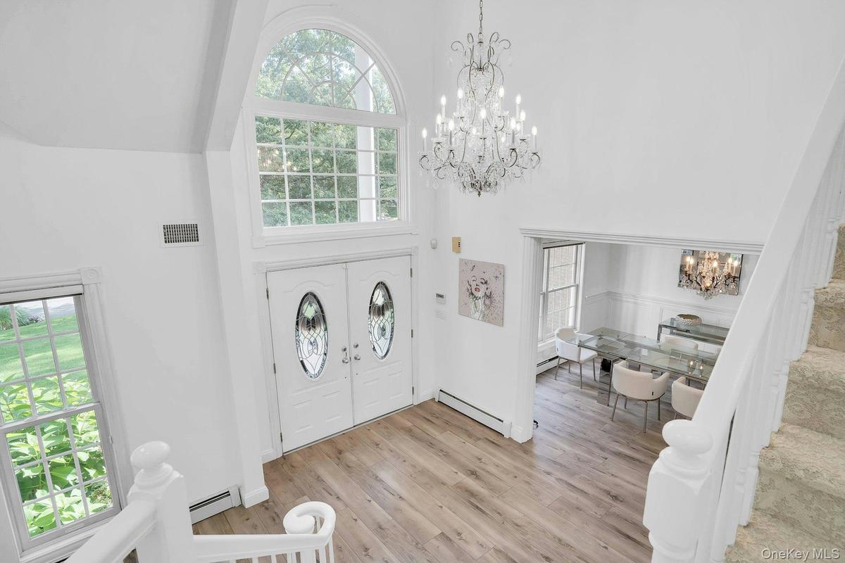 Radiant chandelier highlights the foyer.