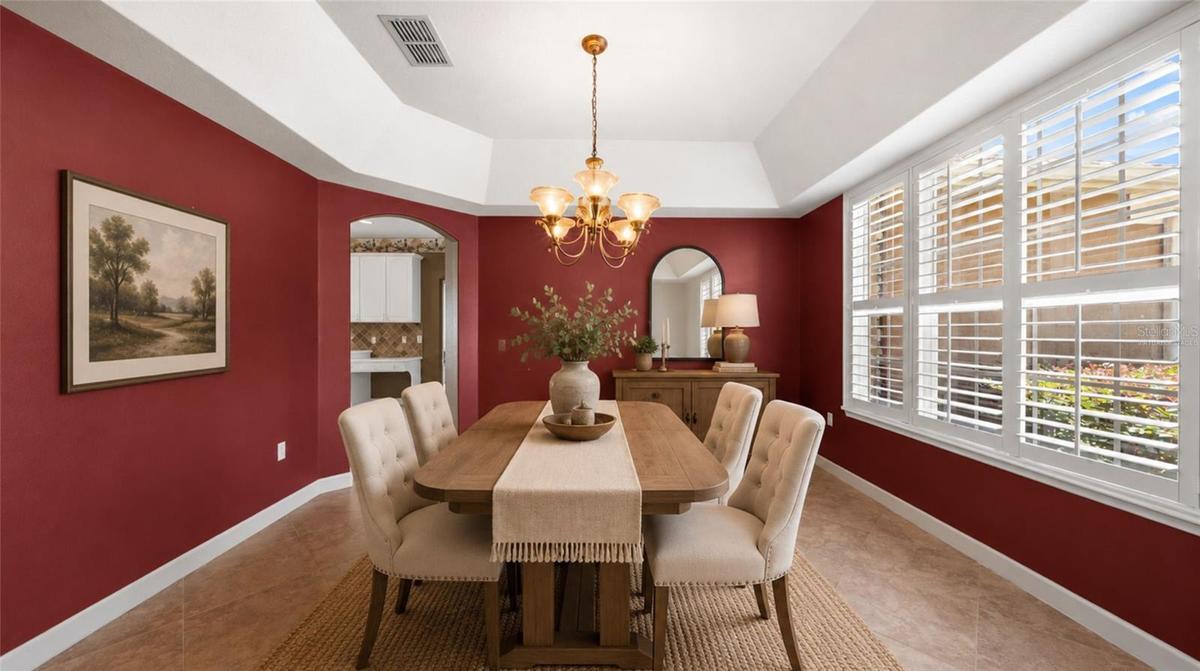 Formal dining room for large family gatherings. (virtually staged)