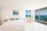Wake up to the ocean from the floor to ceiling window