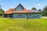 Welcome to 4617 Round Lake Rd: a custom two-story home on sprawling acreage in Apopka with owned solar panels and timeless curb appeal.