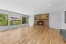 Unfurnished living room featuring baseboards, a fireplace, light wood-style floors, and recessed lighting