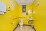 Bathroom featuring light tile patterned flooring and a paneled ceiling
