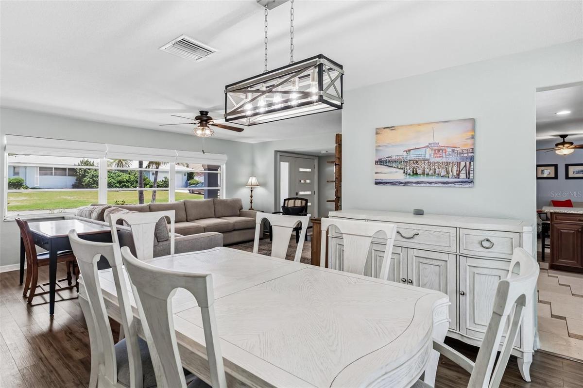 Dining with a view of the expansive living room windows