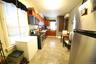 Kitchen with a wall mounted AC, stainless steel appliances, tasteful backsplash, reddish brown cabinets, and light tile patterned floors