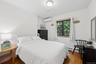 Hardwood-finish flooring complementing white walls