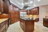 Custom Kitchen: Prep Sink, Snackbar, Custom Cabinets with under and over lighting, Hybrid Induction Cooktop, Hidden walk-in pantry