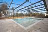 Elegant marble pool decking adds timeless luxury feel while staying cool underfoot for effortless outdoor living.