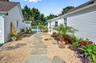 View of yard featuring a fenced in pool and a patio