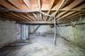 Unfinished basement with gas water heater