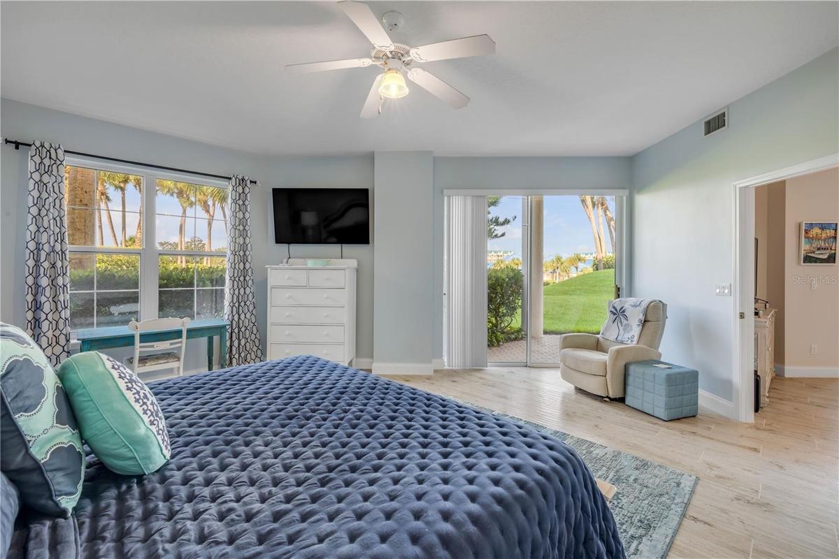 Primary suite with sliders to the patio