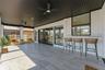 Screened patio with pass through bar